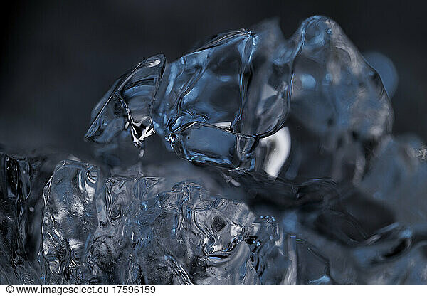 Studio shot of clear lumps of melting ice