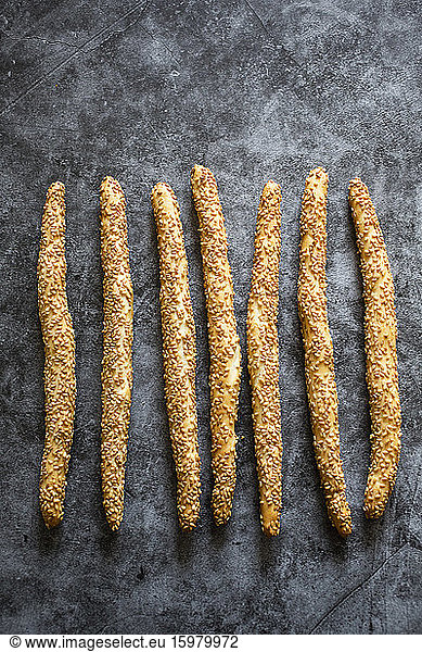 Studio shot of Italian grissini breadsticks with sesame seeds