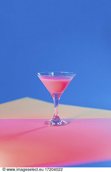 Studio shot of martini glass with pink liquid
