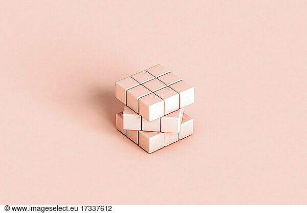 Studio shot of pastel colored blank puzzle cube