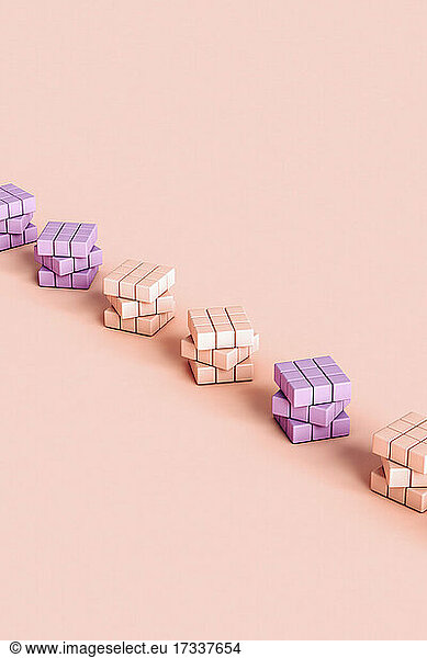 Studio shot of pastel colored blank puzzle cubes