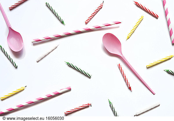 Studio shot of plastic spoons and birthday candles