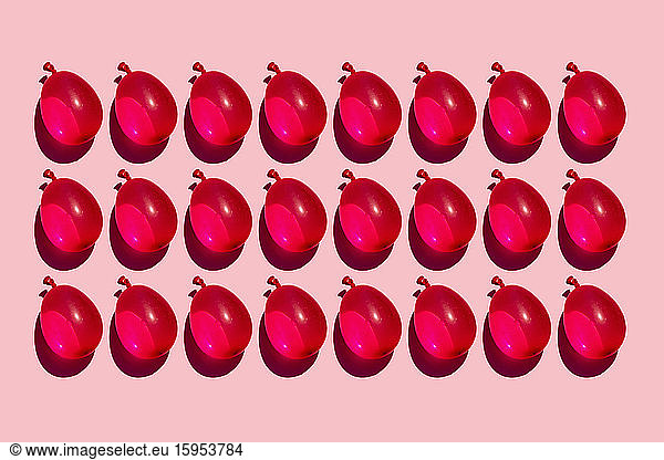 Studio shot of rows of red water balloons