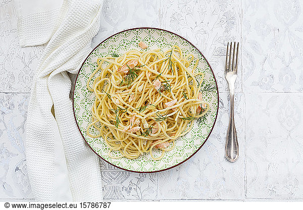 Studio shot of spaghetti with salmon  cream and dill