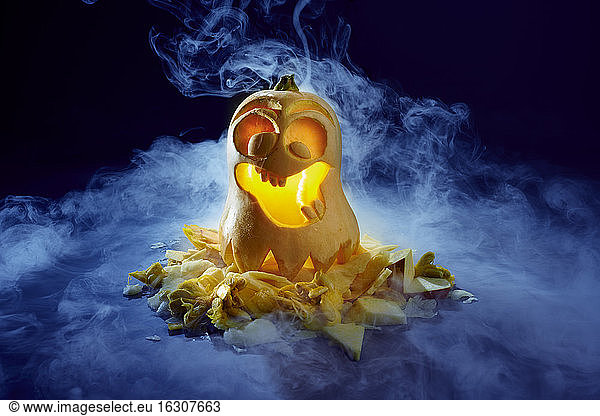 Studio shot of spooky jack-o-lantern made of butternut squash