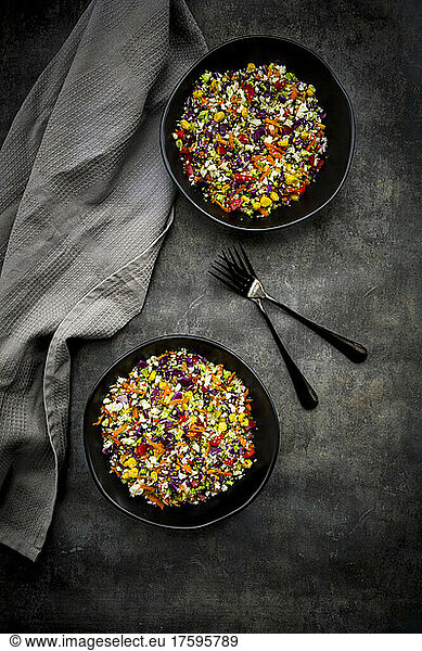 Studio shot of two bowls of colorful vegan salad