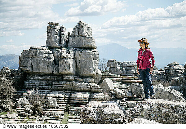 Stylish hiker woman with hat posing.