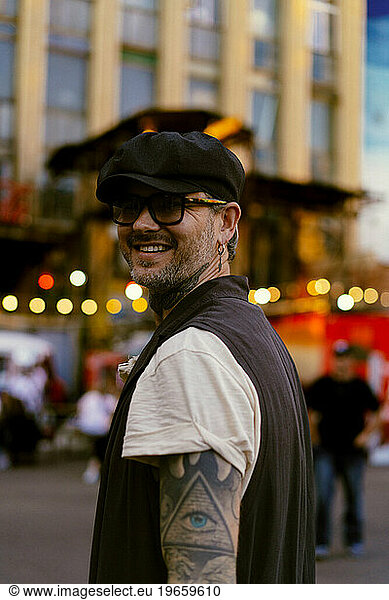 Stylish tattooed man. Urban lifestyle.