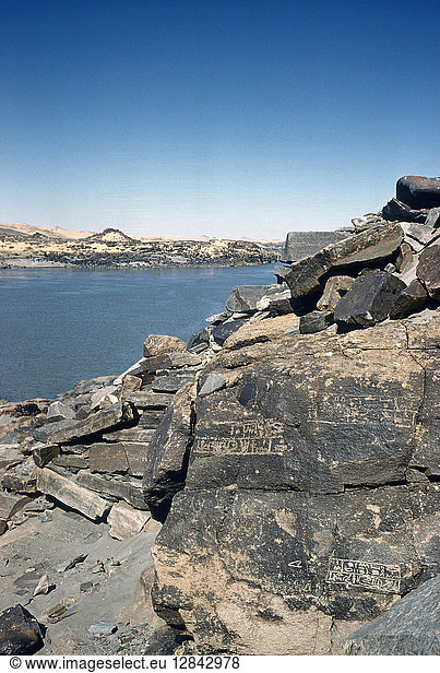 SUDAN: SEMNA EAST/WEST. A view of the Nile River between Semna East (or Kumma in foreground) and Semna West in Nubia northern Sudan showing rocks with Egyptian inscriptions of the 12th Dynasty indicating water levels. Photographed c1970.