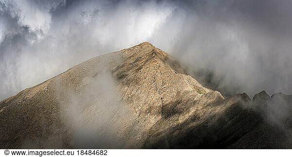 Summit of Mount Artos amidst cloudy sky
