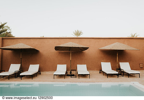 Sun loungers by hotel pool  Douba  Morocco