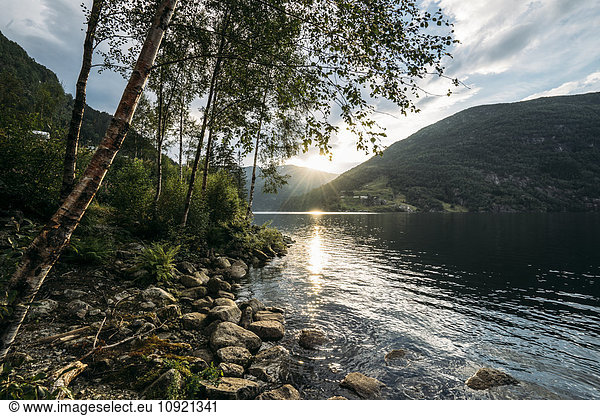 Sun setting over tranquil lake  Norway