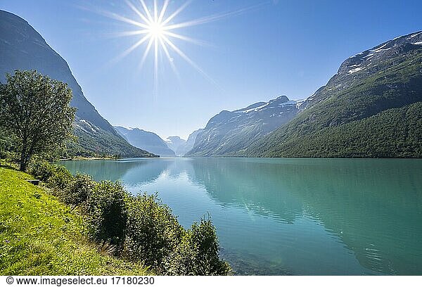 Sun shining at lake Lovatnet and mountains  Loen  Vestland  Norway  Europe