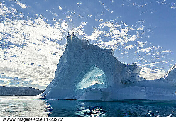 Sunburst on iceberg in Holms O  Baffin Bay  on the northwest coast of Greenland  Polar Regions