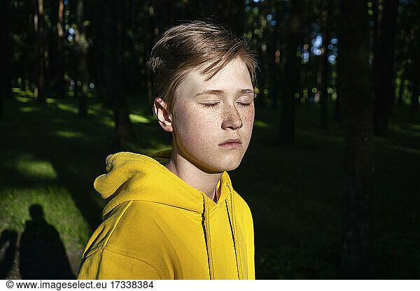 Sunlight on boy with eyes closed