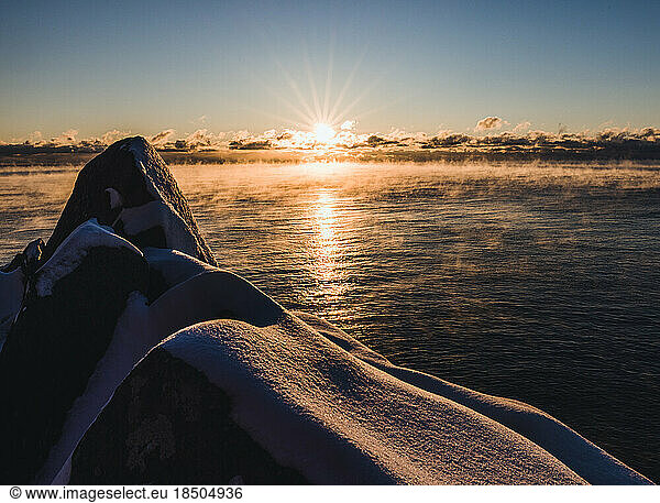 sunrise on a very cold morning along Maine Coast seasmoke