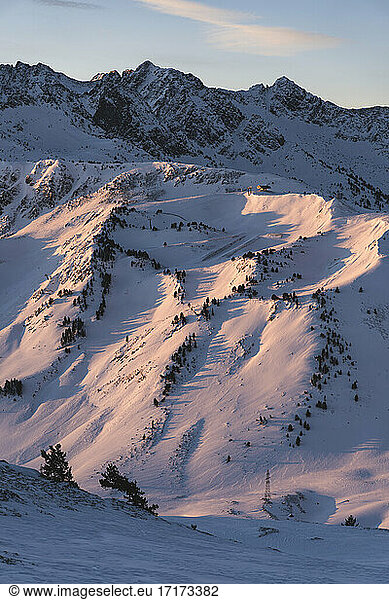 Sunrise over snow covered landscape
