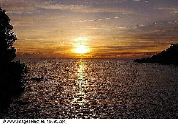 Sunrise  Sea  Landscape  Dawn  Sunlight  Sa Font de sa Cala  Majorca  The rising sun casts its light on the water of the Mediterranean Sea