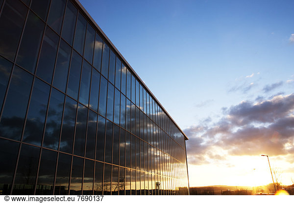 Sunrise sky reflected in modern building windows