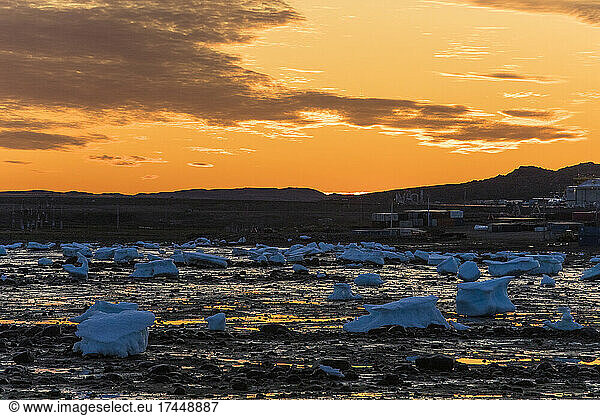 Sunset above melting ice chunks  Iqaluit  Canada.