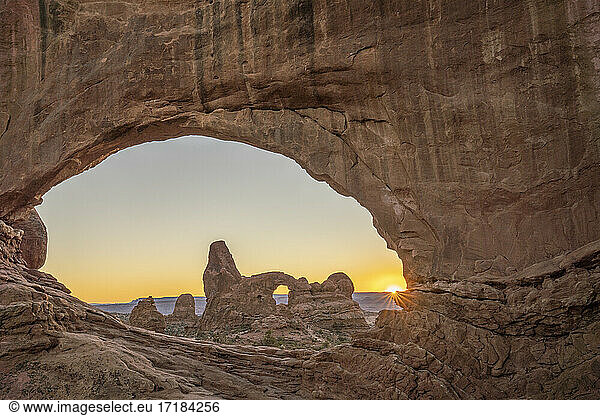 Sunset and Turret Arch view through Windows Arch  Arches National Park  Utah  United States of America  North America