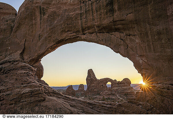 Sunset and Turret Arch view through Windows Arch  Arches National Park  Utah  United States of America  North America