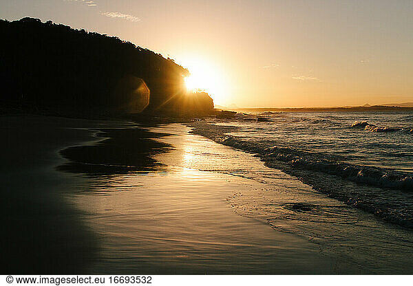 Sunset at high tide on a secluded beach in Australia