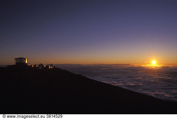 Sunset behind the observatory on Haleakala crater  Maui  Hawaii  USA
