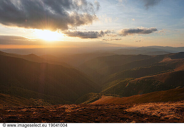 Sunset in the mountains landscape. Dramatic sky. Carpathian