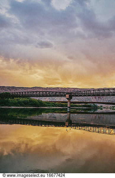 Sunset landscape of a bridge over the Colorado River in Moab  Utah.