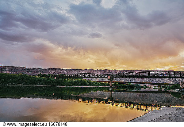 Sunset landscape of a bridge over the Colorado River in Moab  Utah.