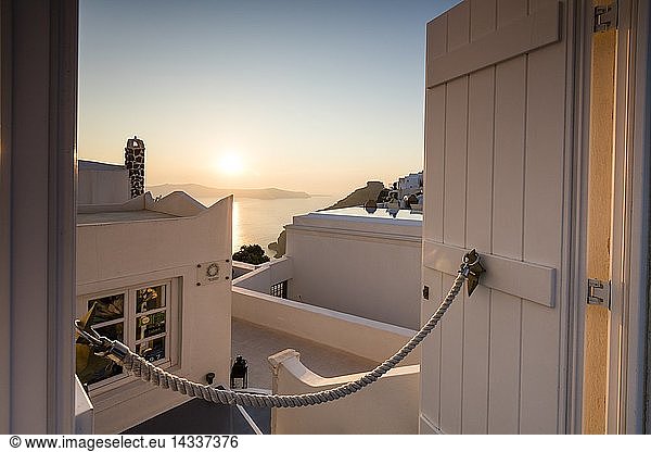 Sunset on Aegean Sea seen from a typical Greek house in the old village of Firostefani  Santorini  Cyclades  Greece  Europe