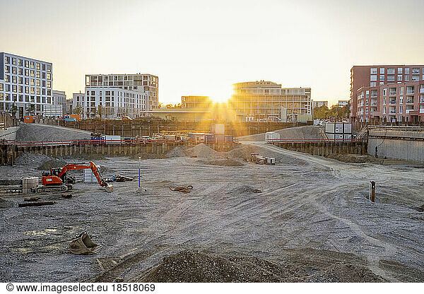 Sunset over empty under construction site