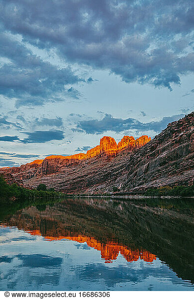 Sunset over mountain by Colorado River in Moab  Utah.
