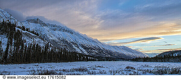 Sunset over the Grey Ridge mountains above Annie Lake in winter; Whitehorse  Yukon  Canada
