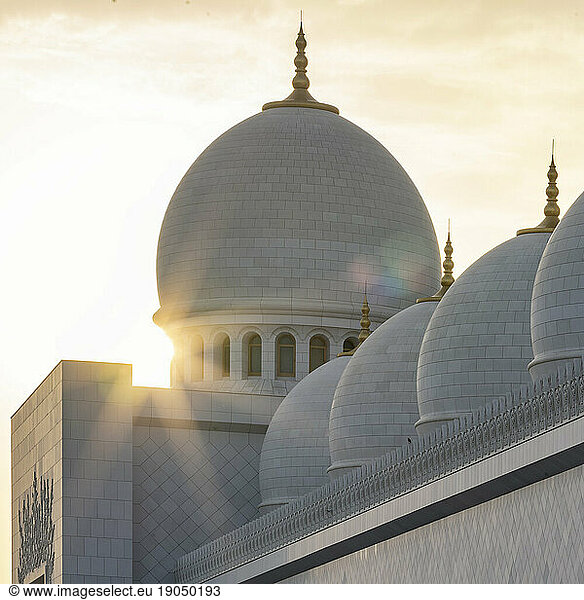 Sunstar against the Dome of Sheikh Zayed Mosque during Golden hour