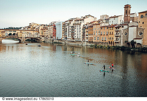SUP under the Ponte Vecchio in Florence  Italy.