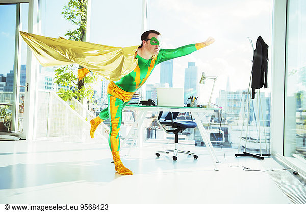 Superhero flying in office