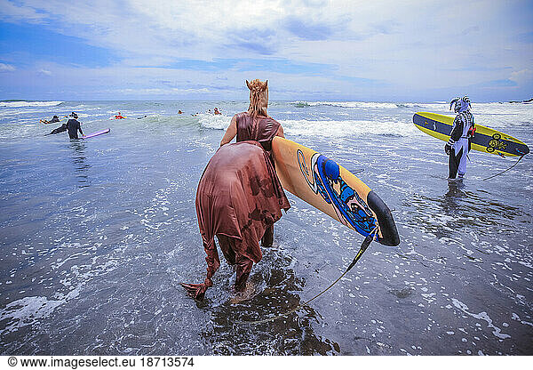 Surf in a carnival costumes  Bali  Indonesia.