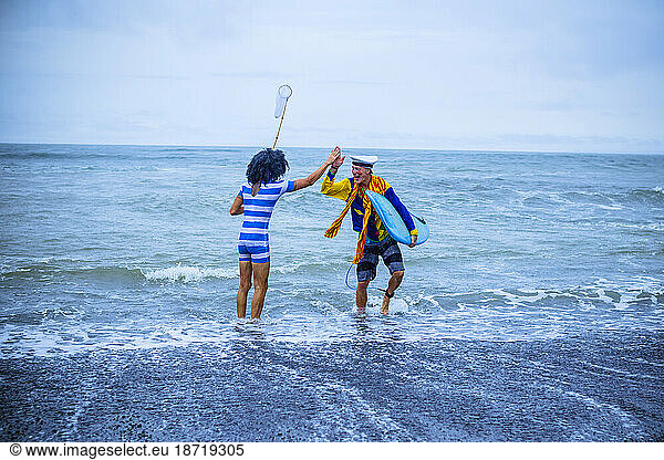Surf in a carnival costumes  Bali  Indonesia.
