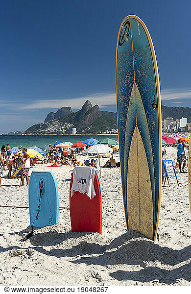 Surfboards on the sand in Ipanema beach on a sunny day