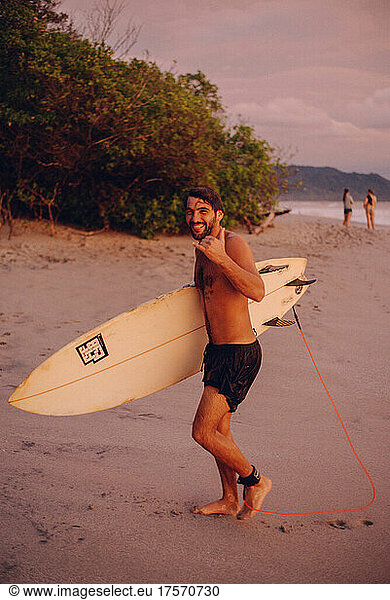 surfer boy smiling after a surf session