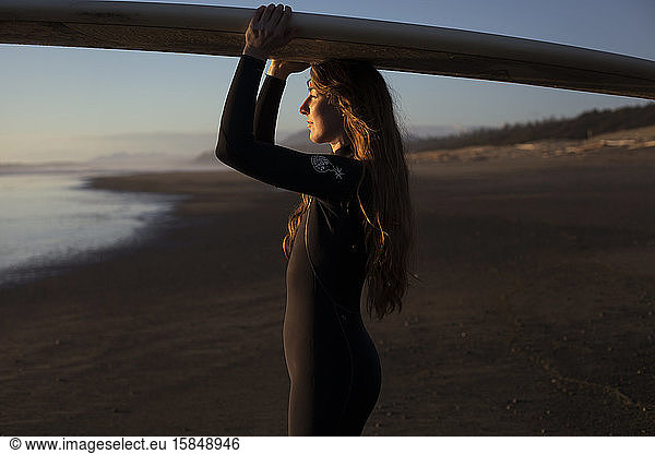 Surfer girl on the beach near Tofino