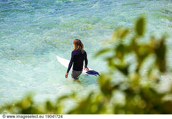 Surfer in clean ocean water.