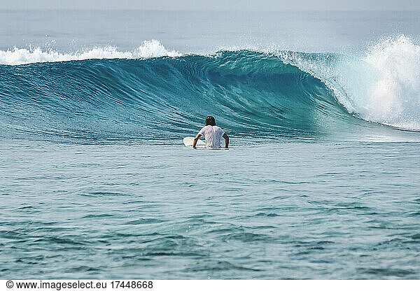 Surfer in Indian Ocean looking at wave