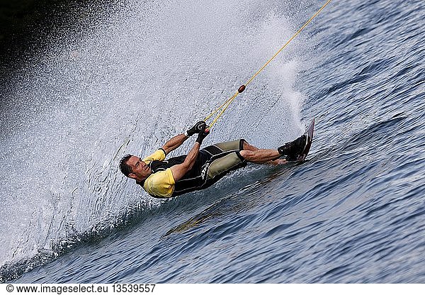 Surfer on a wakeboard  on a lake in Erfurt  Thuringia  Germany  Europe