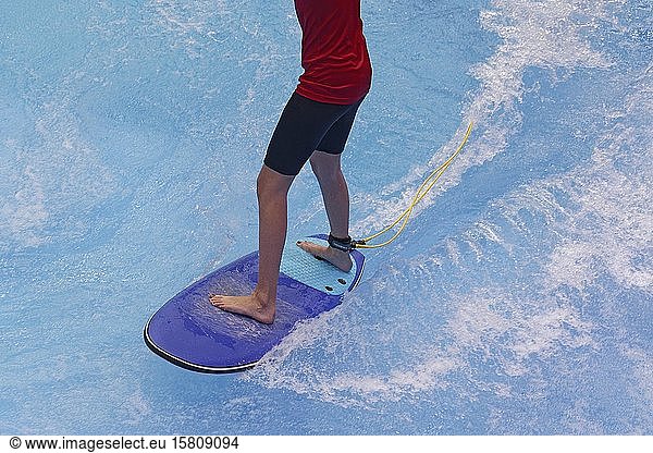 Surfers on wakeskate  board and legs  indoor water pool  Boot 2020  world's largest boat and water sports exhibition  Düsseldorf  North Rhine-Westphalia  Germany  Europe