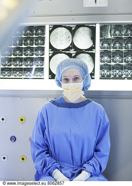Surgeon sitting with x-rays