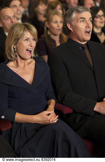 Surprised couple in theater audience