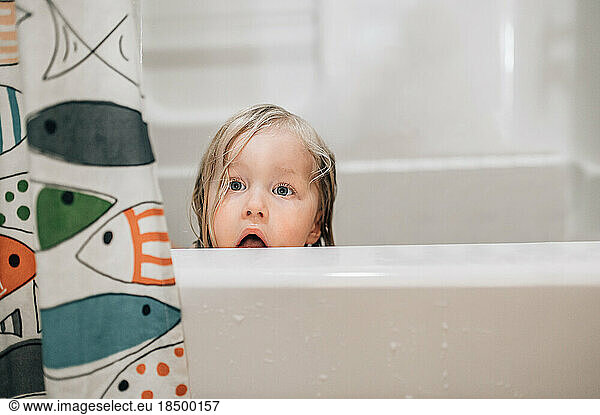 surprised girl in bath tub
